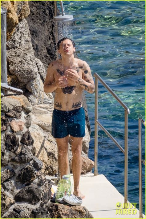 Harry Styles Shows Off His Tattooed Body While Showering At The Beach