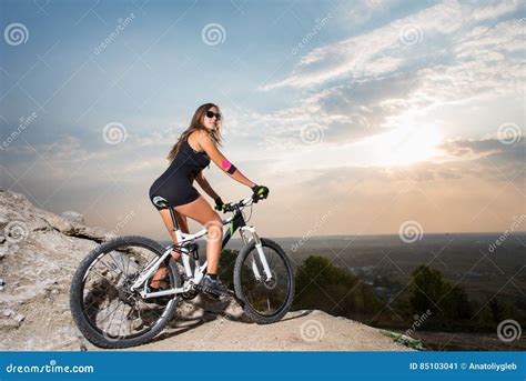 Woman With The Mountain Bike Under A Sky At Sunset Stock Image Image