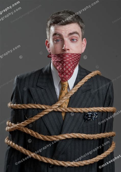 Well Dressed Man In A Suit Tied Up And Gagged With A Handkerchief Matt Mckee Creative
