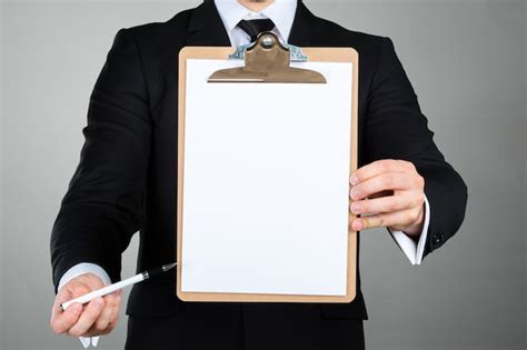 Premium Photo Businessman Holding A Clipboard