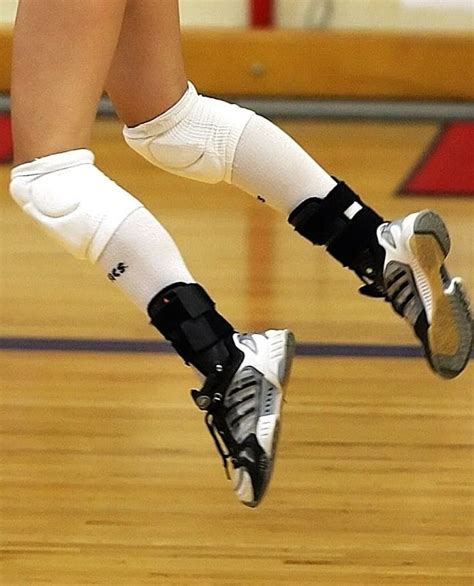 Volleyball Player Jumping Wearing Knee Pads And Ankle Braces Volleyball Rules Indoor