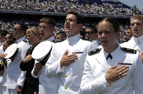 graduates of the u s naval academy sing the navy blue and gold song during their graduation and