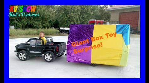 Hauling A Giant Box Toy Surprise Using His Power Wheels Ride On Chevy