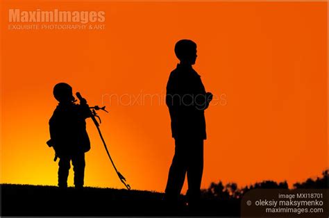 Photo Of Silhouettes Of Two Boys Stock Image Mxi18701