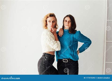 Portrait Of Two Beautiful Young Fashionable Female Girlfriends Together