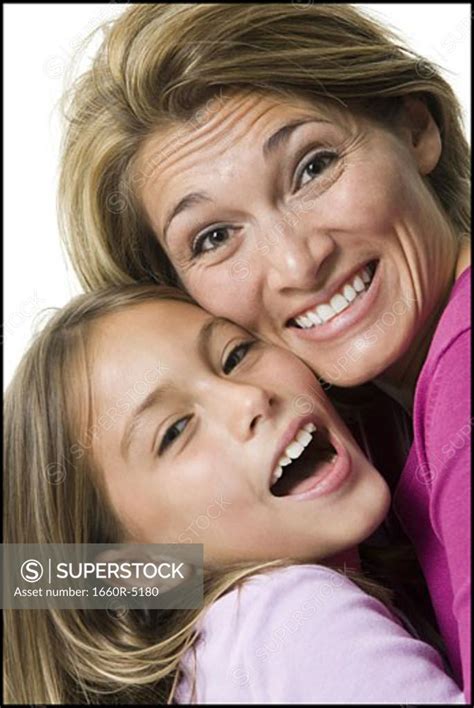 Portrait Of A Daughter Hugging Her Mother Superstock