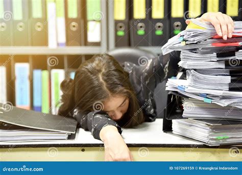 Asian Worker Woman Sleeping On The Workplace Tired Woman Asleep From Working Hard Lot Of Work