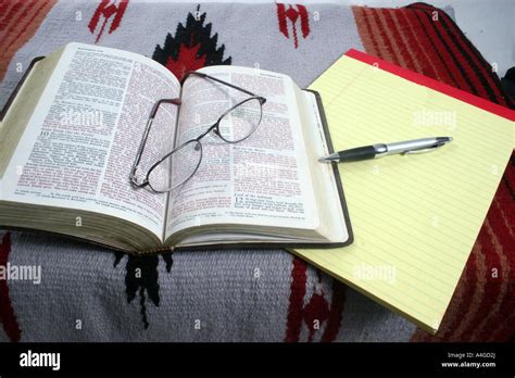 Open Bible With Glasses And Pen With Pad Of Paper Stock Photo Alamy