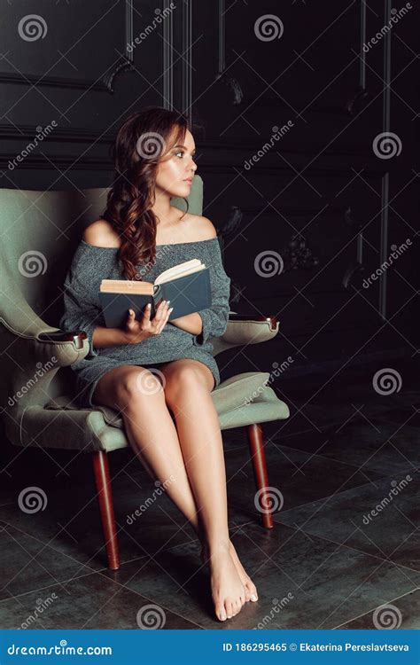 Beautiful Woman Sitting In A Chair And Reading A Book Stock Image Image Of Calm Girl 186295465