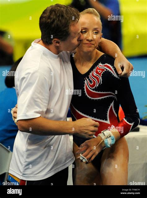 American Gymnast Nastia Liukin Is Kissed By Her Father And Coach Valeri After Her Routine On The