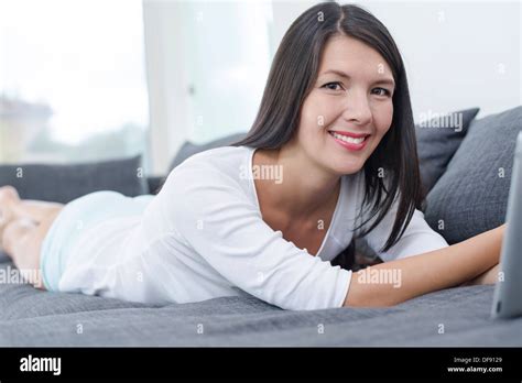 Woman Lying Down On Sofa Hi Res Stock Photography And Images Alamy