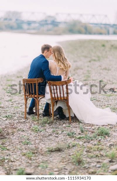Fulllength Back View Hugging Newlyweds While Stock Photo 1115934170