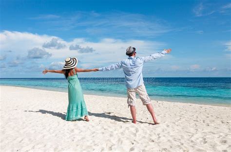 Vacation Couple Walking On Tropical Beach Maldives Stock Photo Image Of Girl Ocean