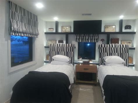 What kind of fabric are roman shades made of? Flat Roman Shades in Twin Bedroom