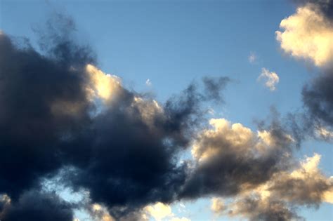 Looking for the best blue sky with clouds wallpaper? Blue Sky with Golden and Black Clouds Picture | Free ...