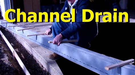 This is the original driveway installed when the house was built 30 years ago. DIY Driveway CHANNEL DRAIN start to finish driveway channel drain grate systems - YouTube