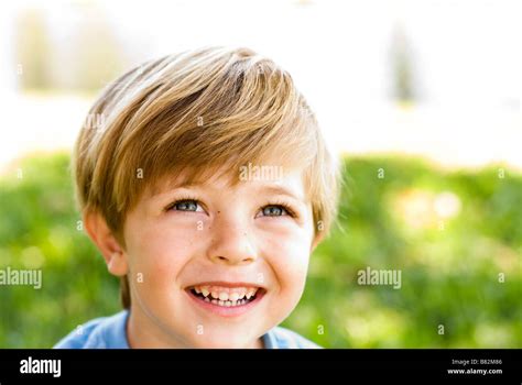 Boy Laughing Outdoors Playing Stock Photo Alamy