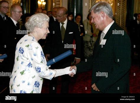 Britains Queen Elizabeth Ii Presents John Anderson Cbe Hi Res Stock