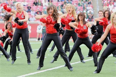A Group Of Cheerleaders Perform On The Field