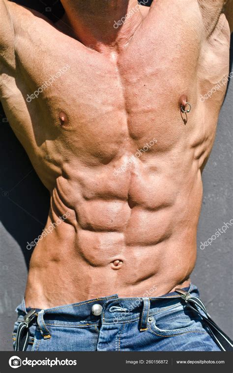 Bodybuilder Torso Arms Ripped Abs Pecs Nipple Piercing Wearing Jeans Stock Photo By Yayimages