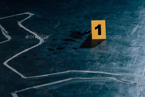 Chalk Outline Knife And Evidence Marker At Crime Scene Stock Photo By