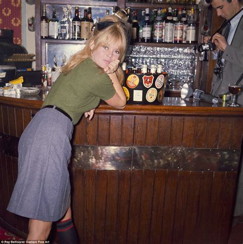 Brigitte Bardot Photos Show Her Sitting On The Bar Of A London Pub