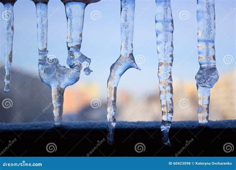 Dripping Icicles Against The Sky Transparent Icicle Close Up Ag Stock