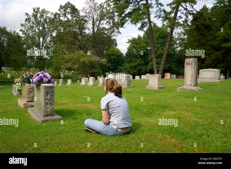 Teen girl mourns the loss of a family member. The young lady sits and