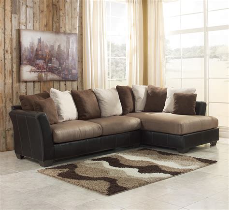 Warm Color Of 2 Piece Sectional Sofa With Chaise With Many Pillows And Small Fur Rug 
