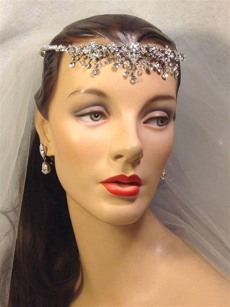 A Mannequin Wearing A Bridal Head Piece