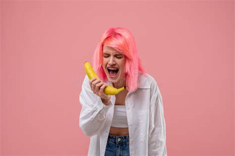 pink haired girl singing into the banana mic stock image image of modern singing 261052153