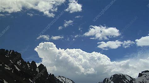Cumulus Clouds Over Mountains Timelapse Stock Video Clip K0035055