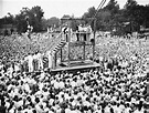 In this Friday, Aug. 14, 1936 file picture, a large crowd watches as ...