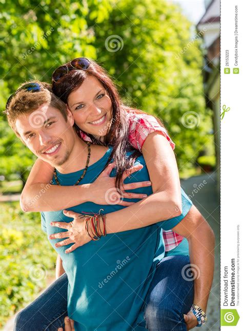 Happy Couple Woman Jump On Man S Back Stock Image Image Of Embrace