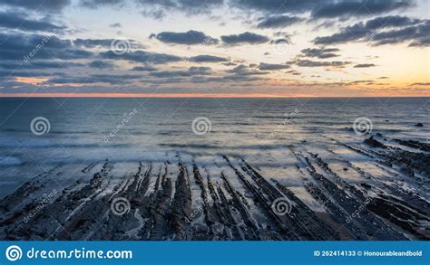 Beautiful Sunset Landscape Image Of Welcome Mouth Beach In Devon