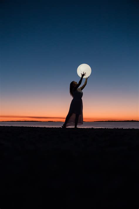 Woman Holding A Moon · Free Stock Photo