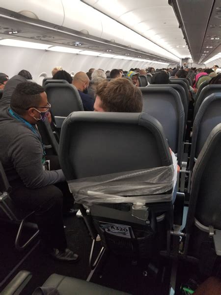 frontier airlines passenger who assaulted flight attendants duct taped to seat on philly plane