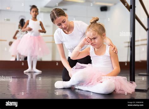 Ballet Teacher Comforting Tired Little Ballerina Stock Photo Alamy