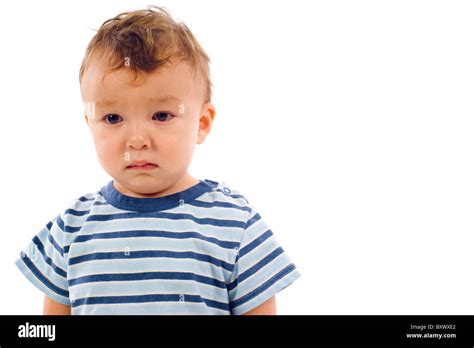 Portrait Of Sad Baby Boy Isolated Over A White Background Stock Photo