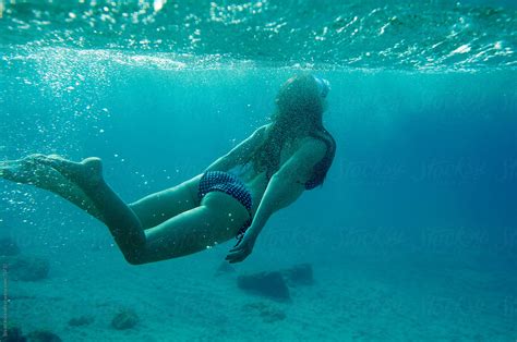 Underwater Photo Of A Woman Diving On The Breath Stocksy United