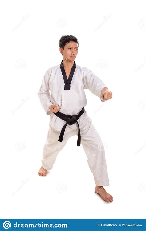 Male Martial Artist Left Punch Strike Full Length Shot Stock Image