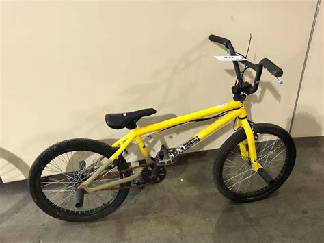 2 Bikes Yellow Haro Bmx Bike And Purple Raleigh Front Suspension