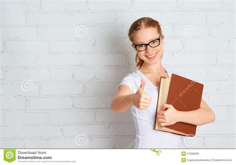 Happy Successful Student Girl With Book Showing Thumbs Up Stock Image
