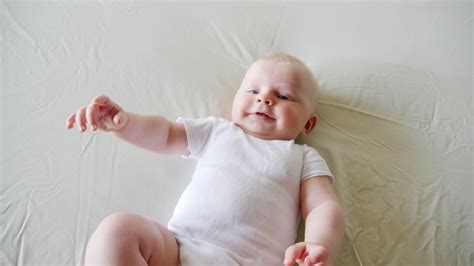 Baby Laughing While Lying On Bed By Kristian Ozer Kettner Royalty