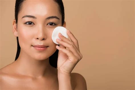 Happy Beautiful Naked Asian Girl Applying Facial Cream Isolated Beige Stock Photo By