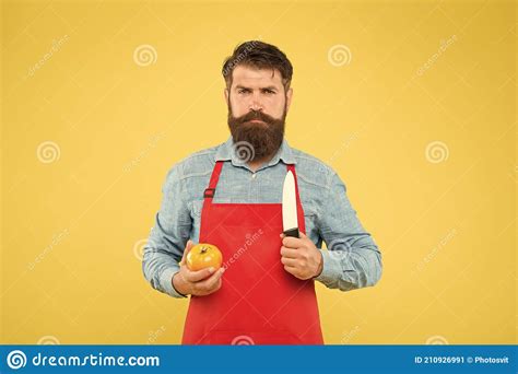 Mature Man Hold Knife And Vegetable Making Fresh Salad Professional Chef In Red Apron Cooking
