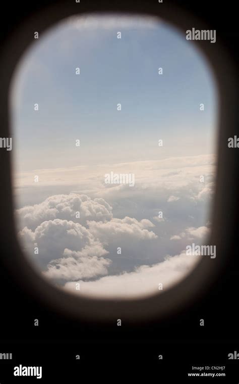 View Of Clouds Through Airplane Window Stock Photo Alamy