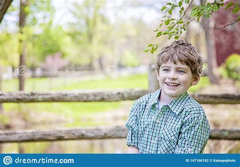 He walked as if running away. Boy On Farm Standing Under A Tree Stock Photo - Image of ...