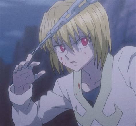 An Anime Character With Blonde Hair And Red Eyes Holding A Scissor
