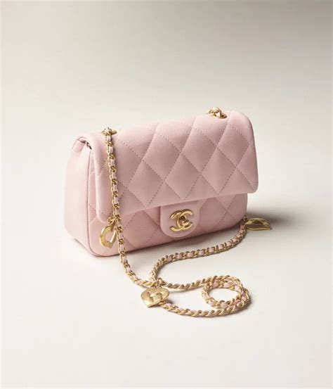Chanels Gorgeous New Mini Flap Bag Is Pink And Comes With Heart Shaped